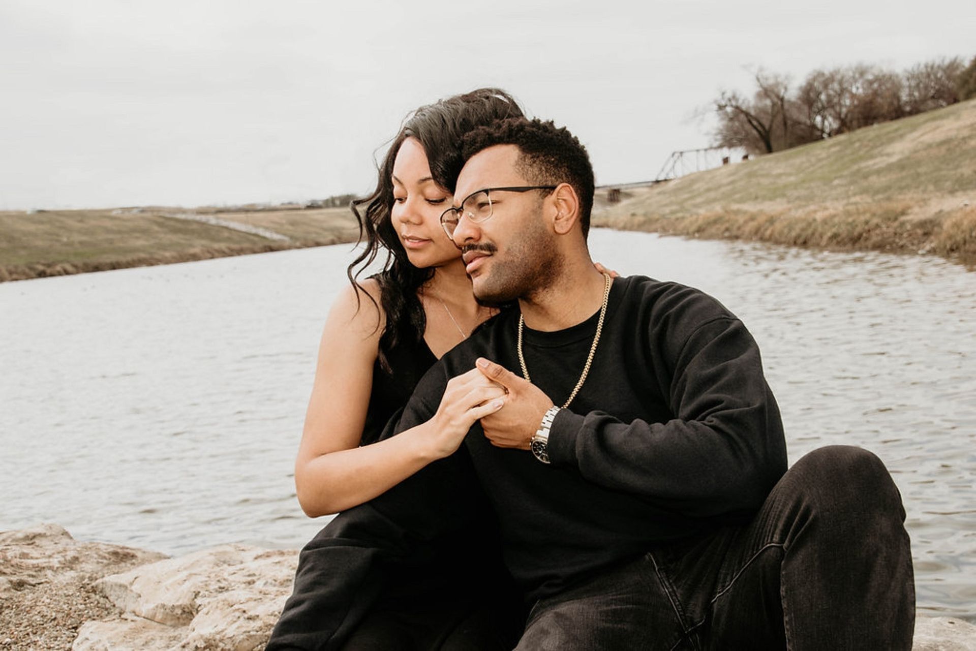 A couple embraces by the water after rekindling the romance in a Couples Retreat in Orlando, FL. Couples Retreats are offered to couples in Florida and throughout the United States.