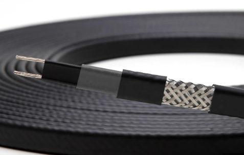 Flat electric heating cable, black with exposed silver wires and protective layers.