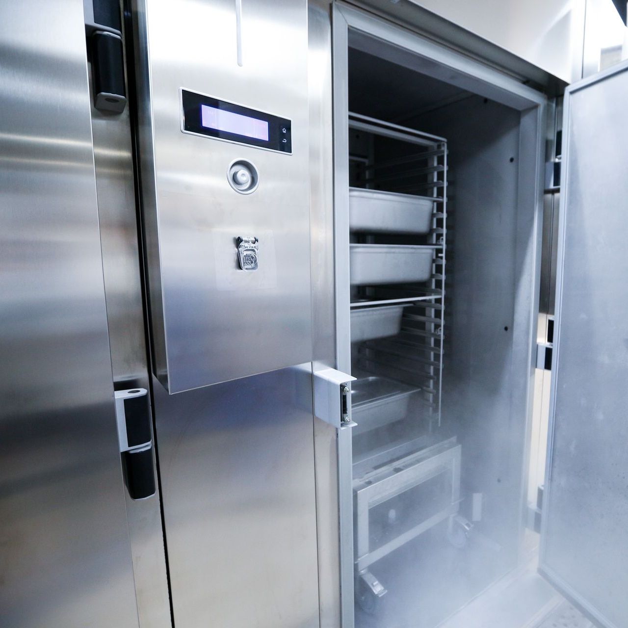 a stainless steel refrigerator with the door open