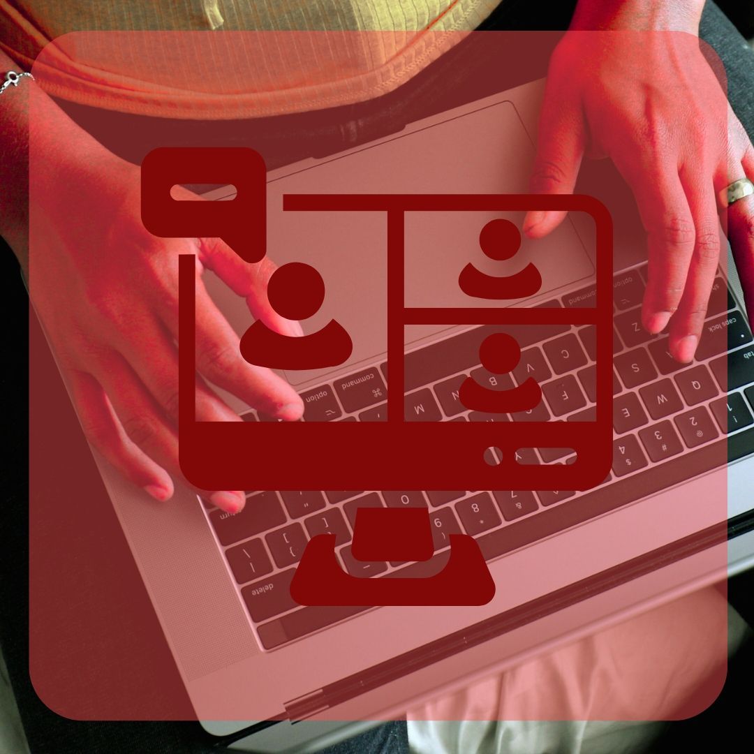 Red overlay of a video call icon on a person using a laptop. Hands on keyboard, with four video call participants.