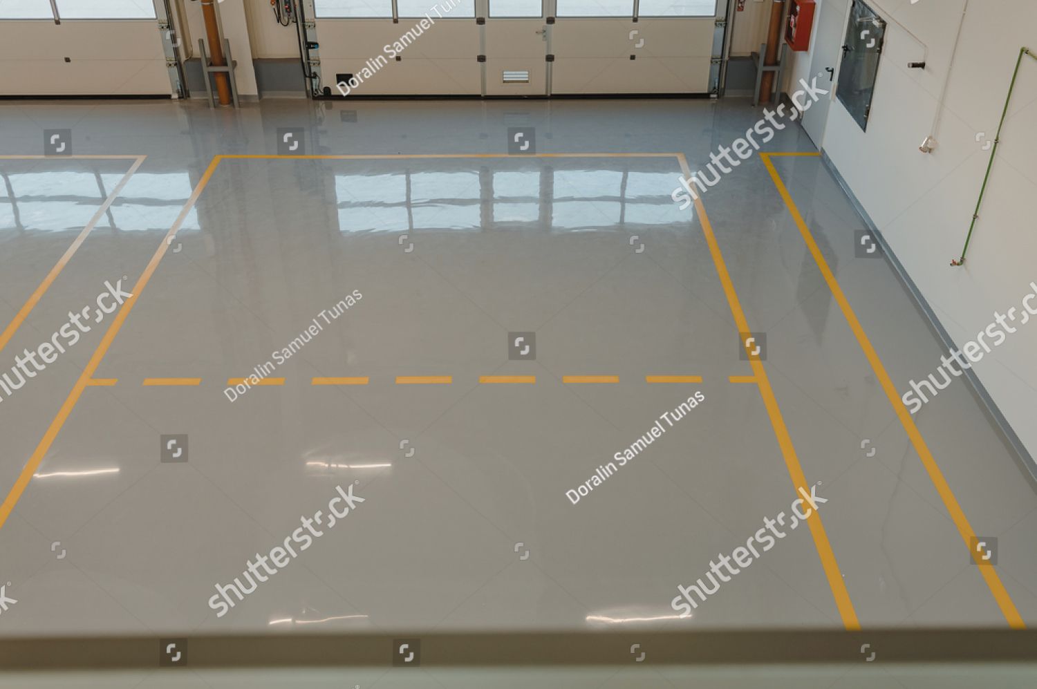 An aerial view of a garage with a yellow line on the floor.