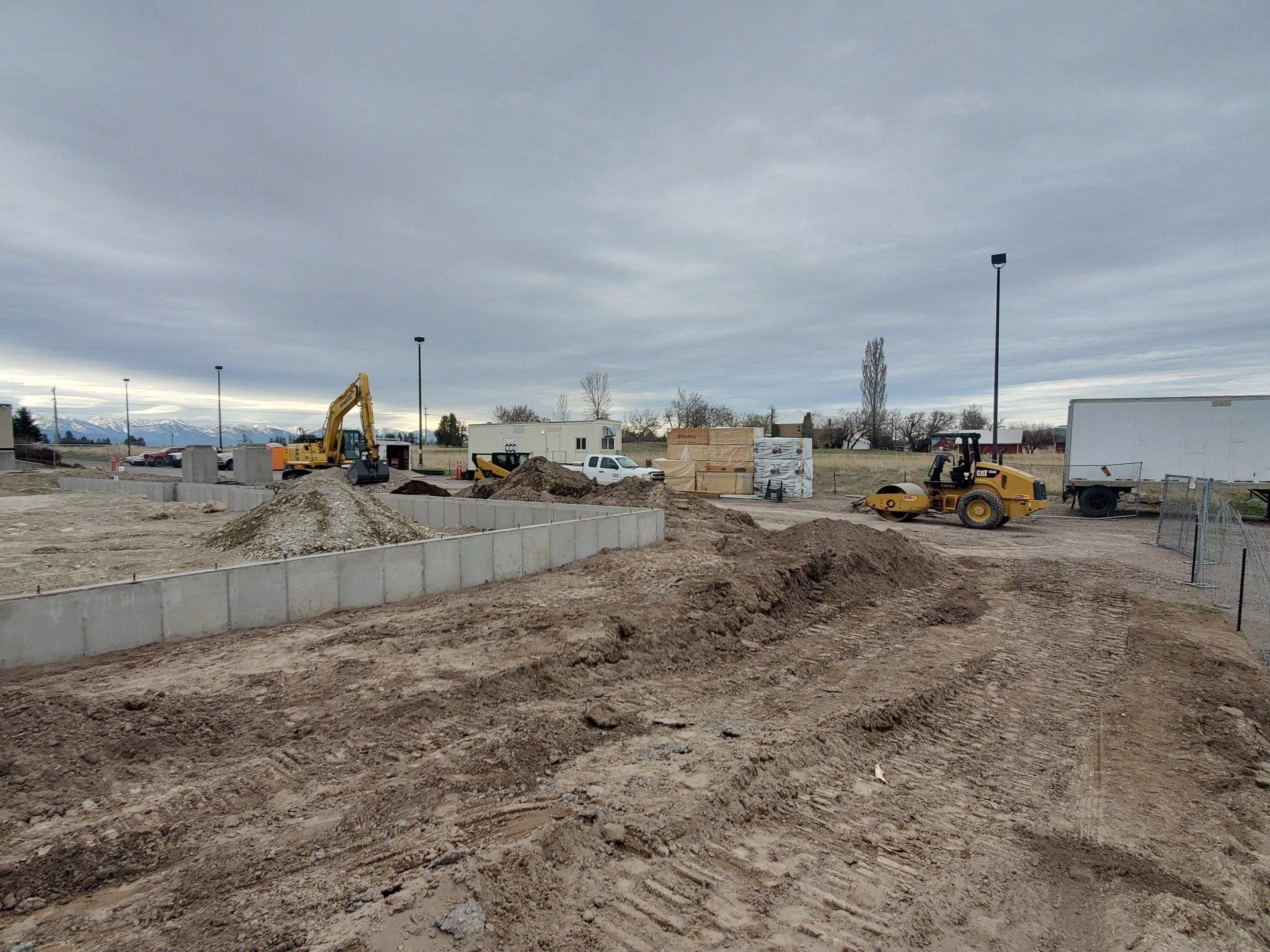 A construction site with a lot of dirt and machinery.