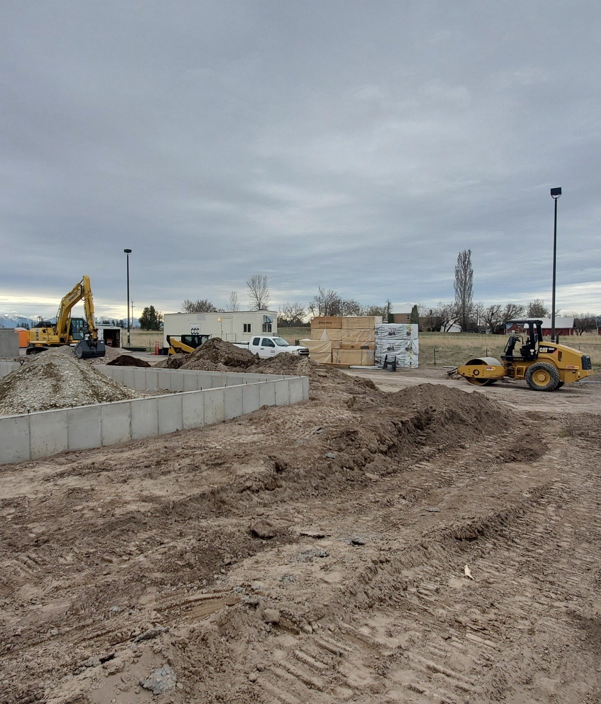 A construction site with a lot of dirt and machinery.