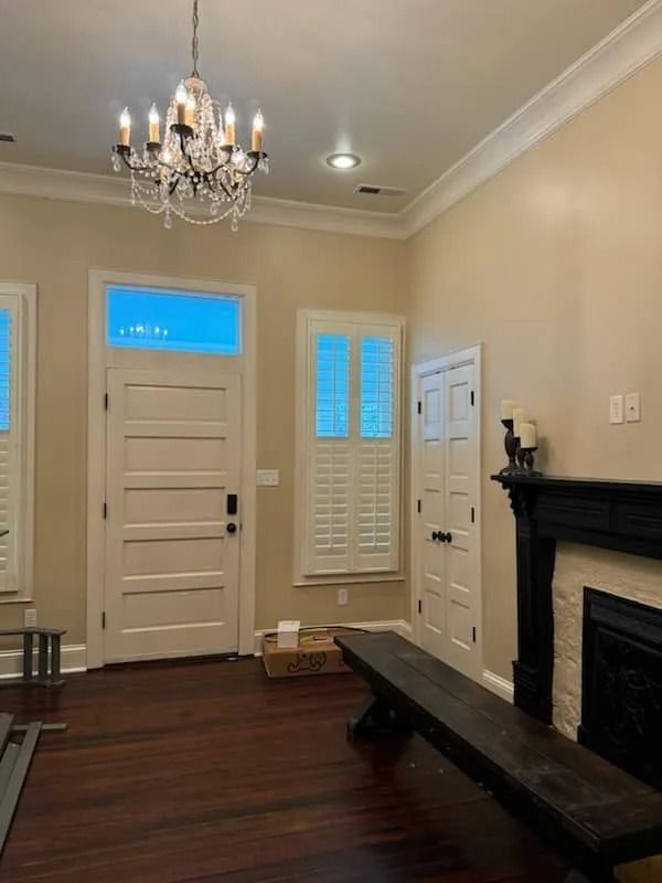 A living room with a fireplace and a bench