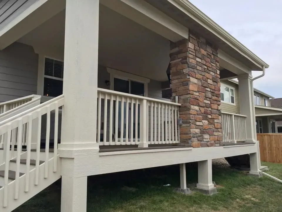Basement under construction with exposed framing, ductwork, and pipes.