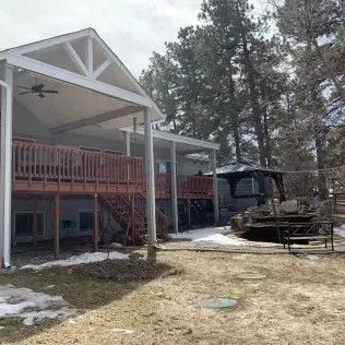 A door frame opening into a room with a window and light-colored flooring.