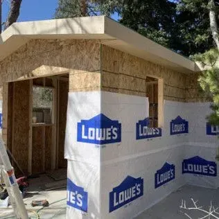 Building exterior, Lowes brand wrap, unfinished wood frame.