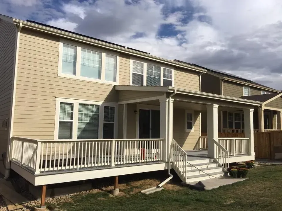 Unfinished basement with concrete floor, exposed ceiling joists, and framed walls. Insulation and ductwork visible.