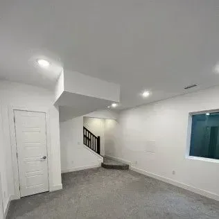 Ocean waves crashing, showing white foam against dark turquoise water.