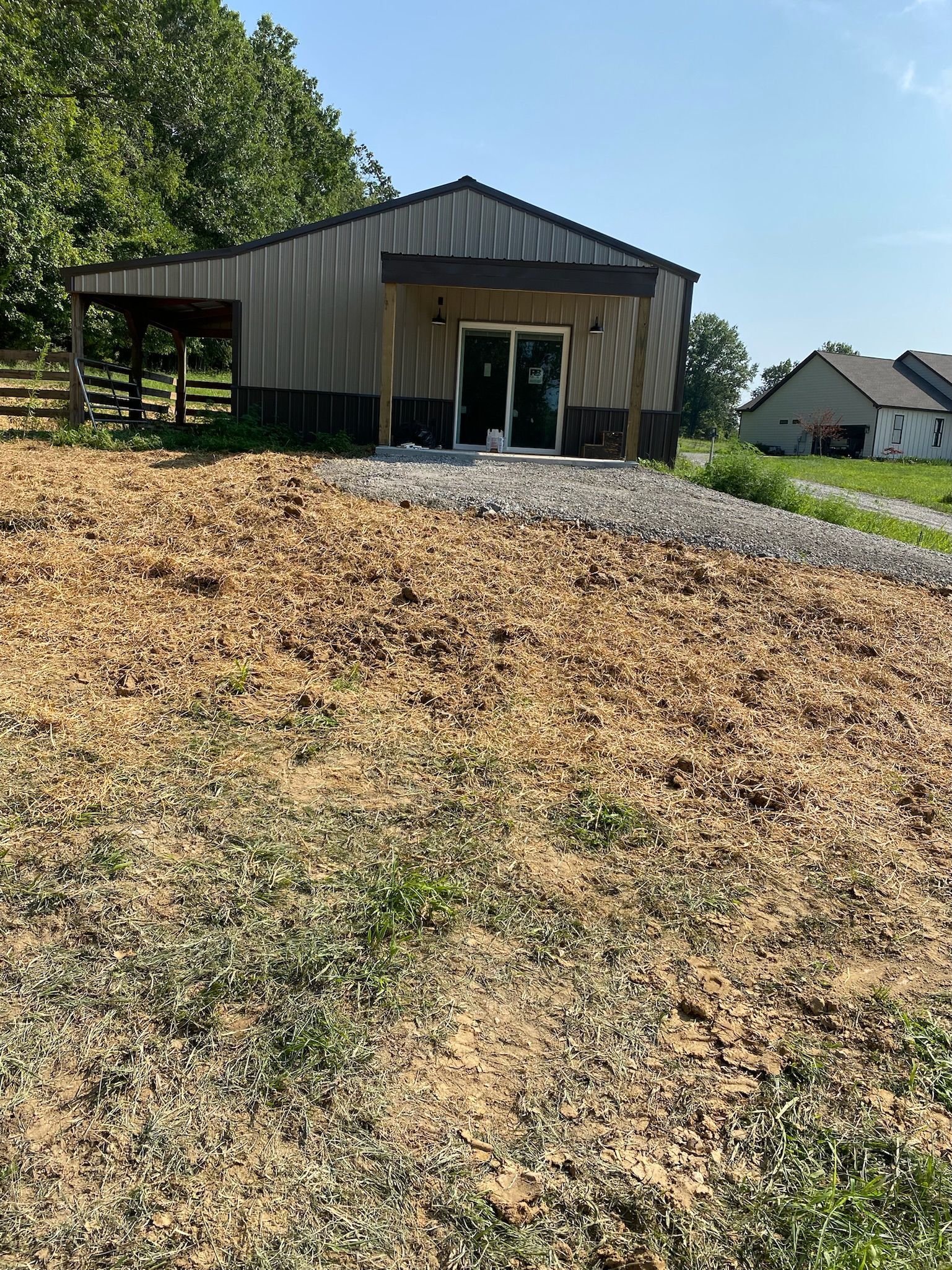 There is a building in the middle of a field.