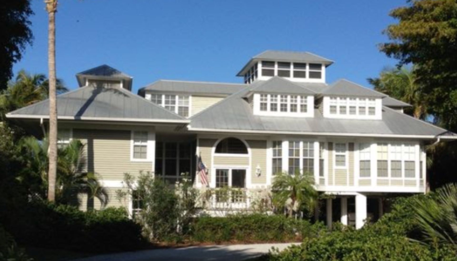 A large white house with a gray roof