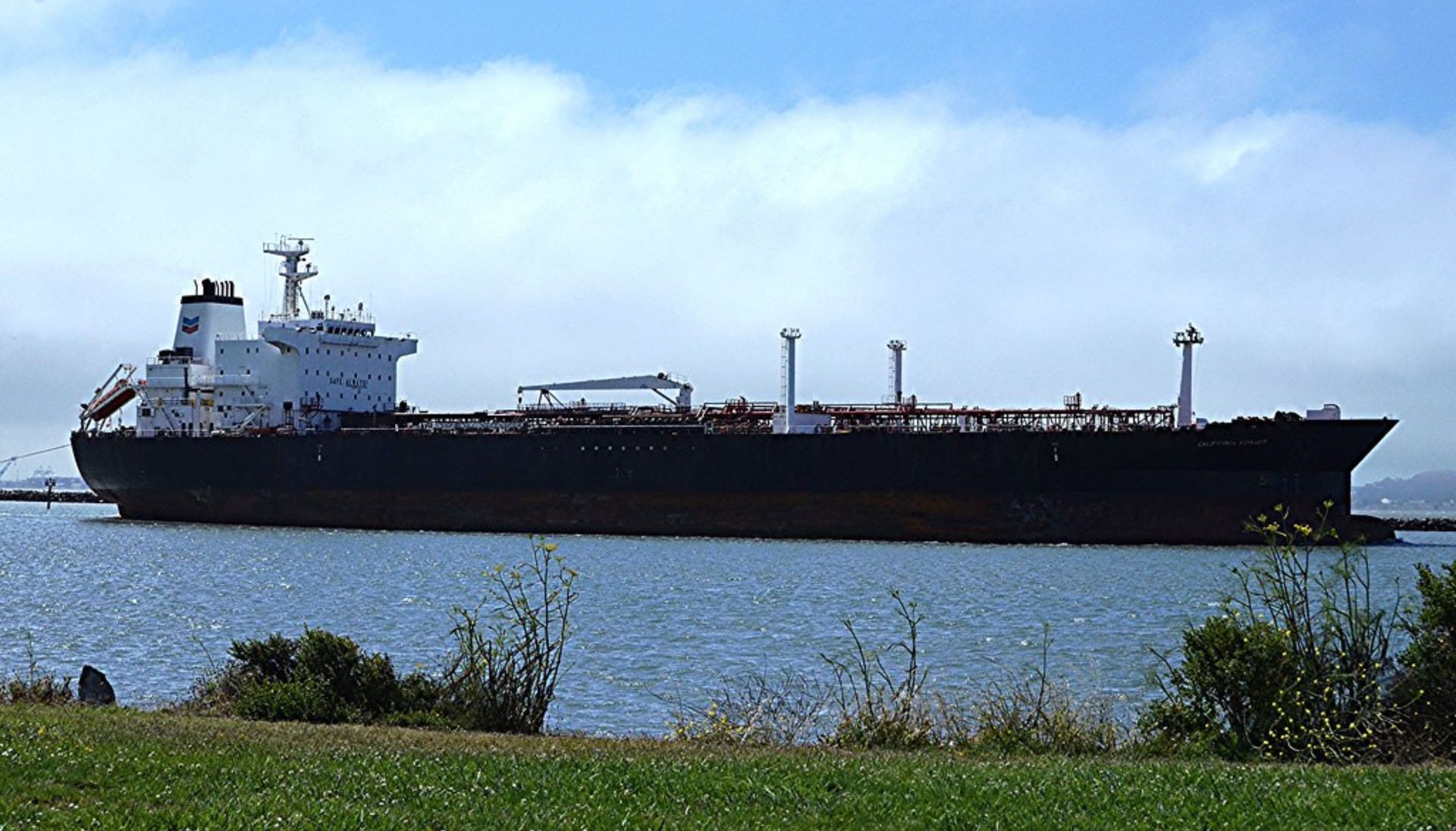 A large ship is docked in a body of water