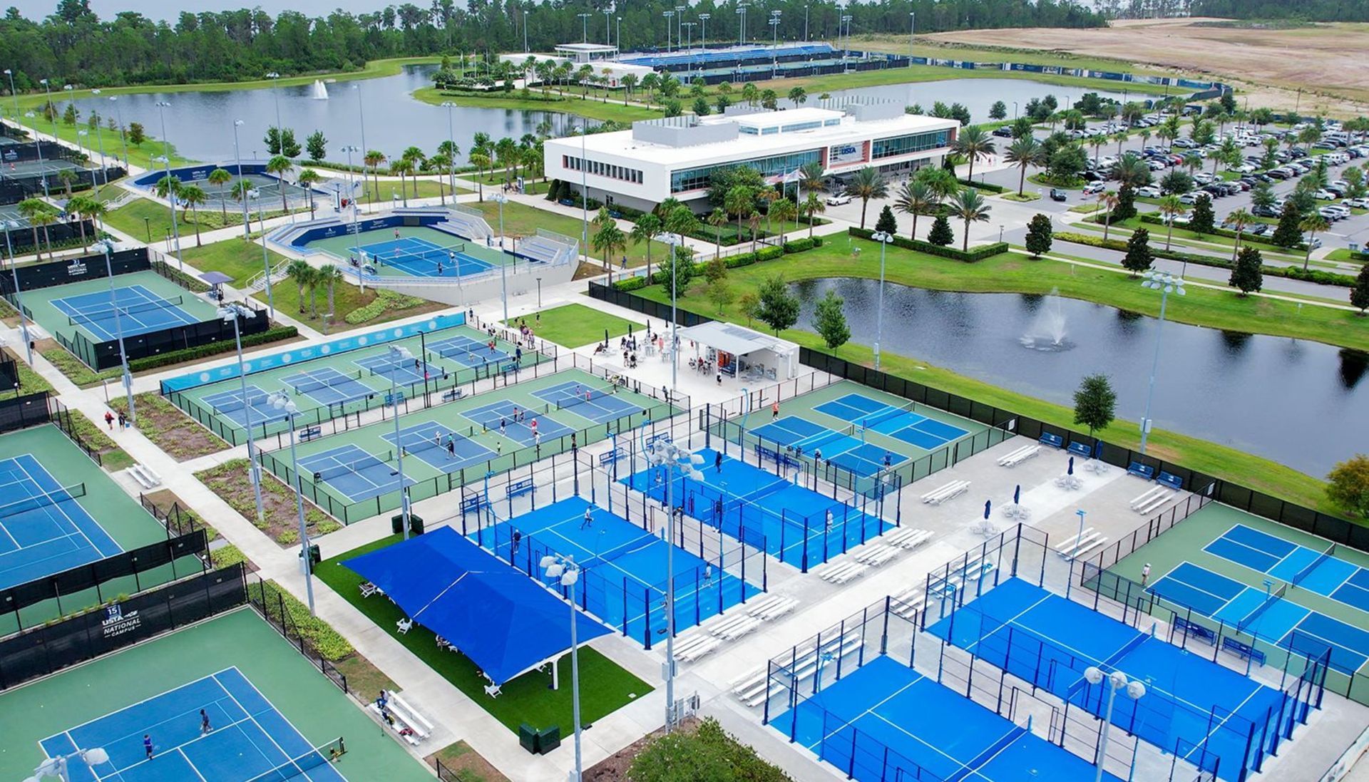 An aerial view of the USTA national campus of multiple tennis courts in Orlando