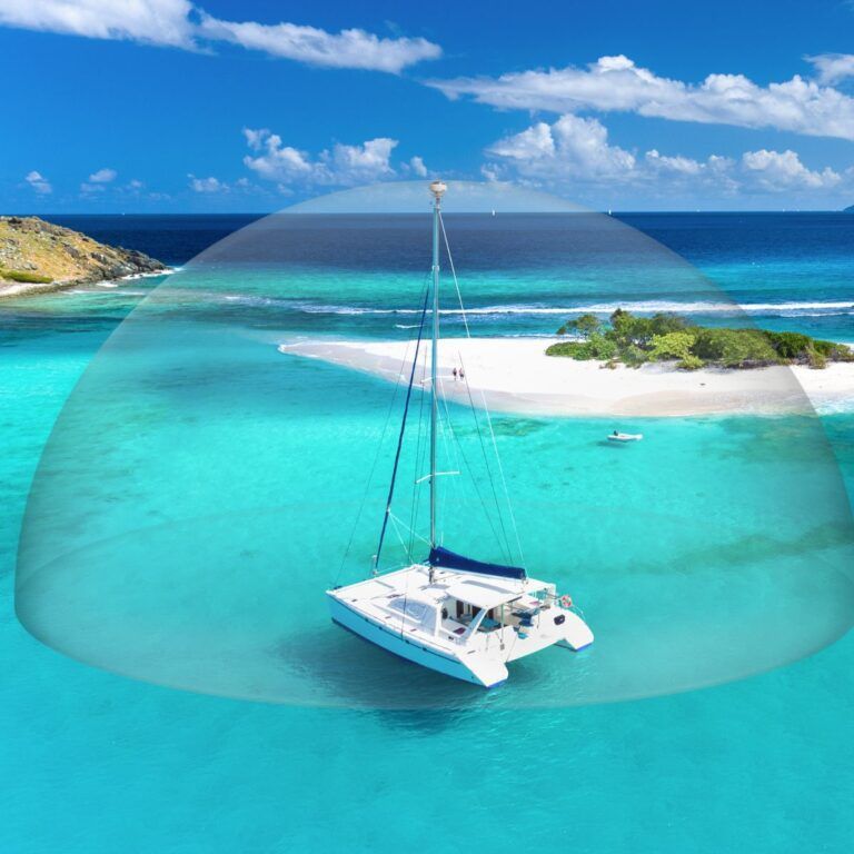 An aerial view of a sailboat in the ocean