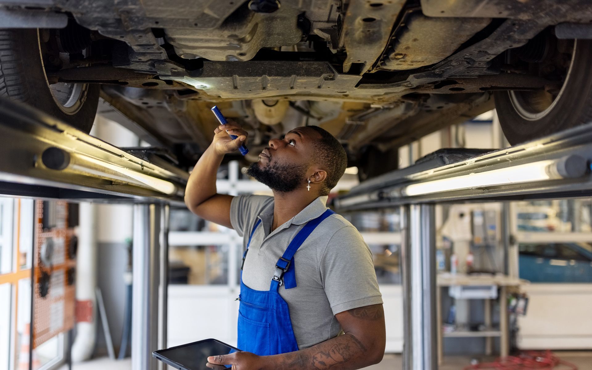 Man Checking Car — Long Lake, MN — Perry’s Truck Repair & Welding