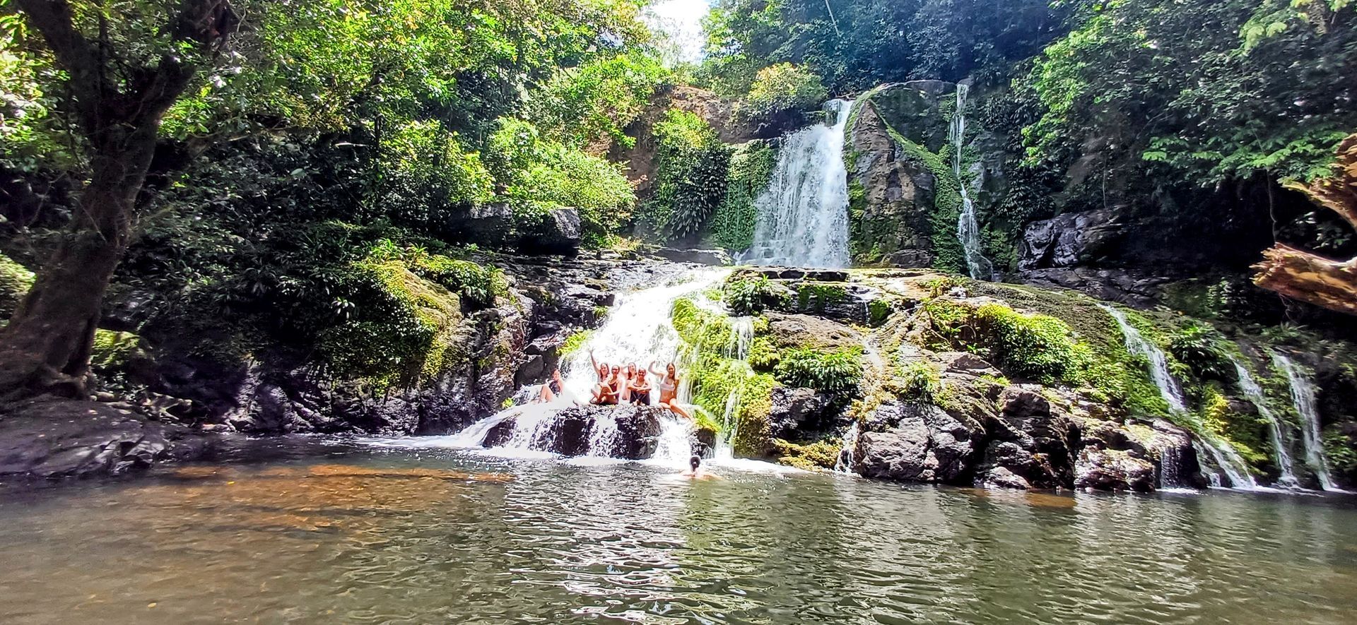 Hike to a waterfall in the rainforest.