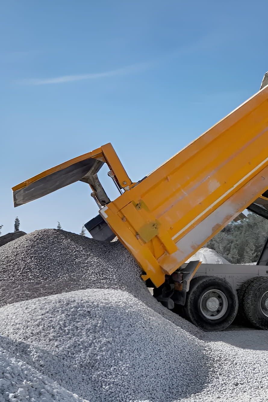 A Yellow Dump Truck is Being Loaded With Gravel —  A & B Mullins Excavations Pty Ltd in Bungadoo, QLD