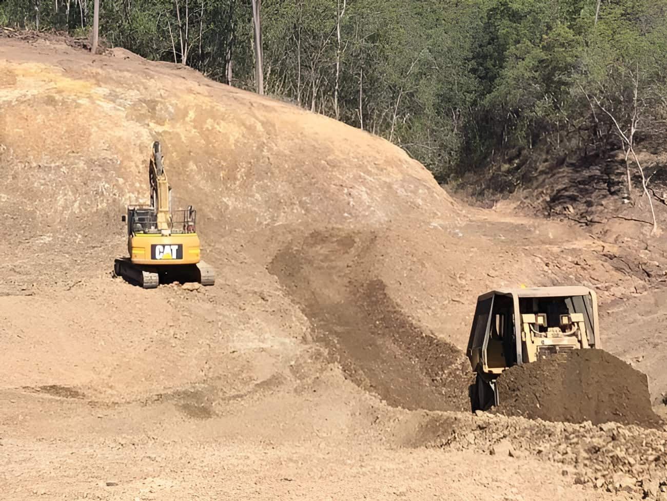 A Bulldozer and an Excavator Are Working on a Dirt Field —  A & B Mullins Excavations Pty Ltd in Bungadoo, QLD
