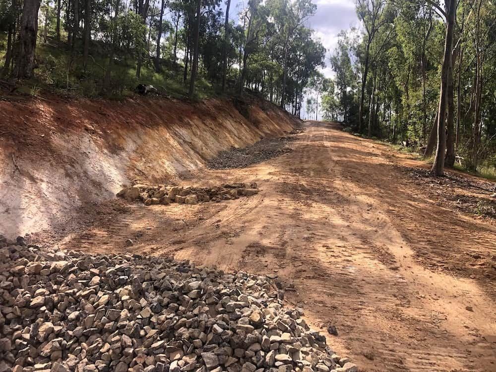 A Dirt Road Going Through a Forest With Rocks on the Side of It —  A & B Mullins Excavations Pty Ltd in Gin Gin, QLD