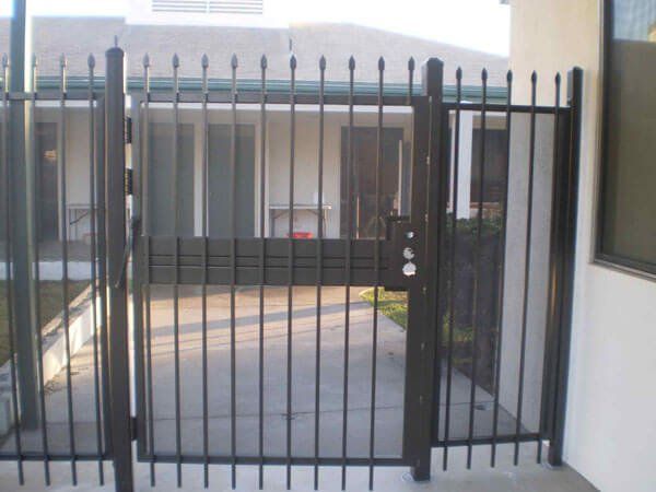 Ornamental Dark Colored Iron Fence Design — Ste. K Santee, CA — Sam's Fencing Inc.