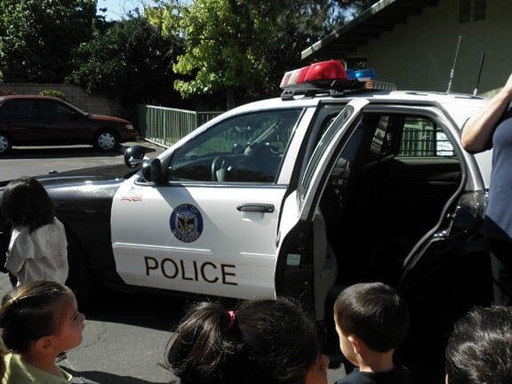 Group of Kids in a Police Car — Riverside, CA — Cottonwood Montessori