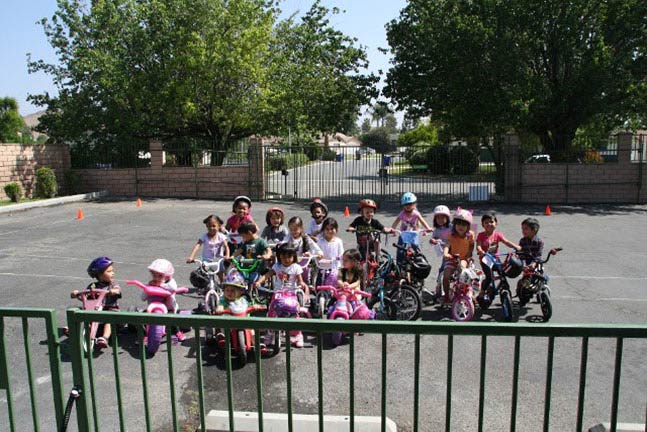 Kids Playing Bicycle — Riverside, CA — Cottonwood Montessori