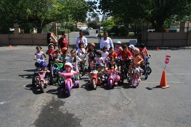 Children Rides Bicycle — Riverside, CA — Cottonwood Montessori
