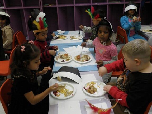 Little Kids Eating at Thanksgiving Party — Riverside, CA — Cottonwood Montessori