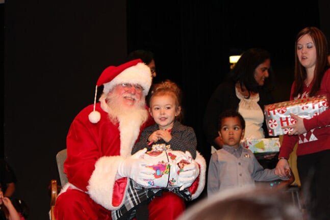 Santa Claus Hugs a Little Girl — Riverside, CA — Cottonwood Montessori