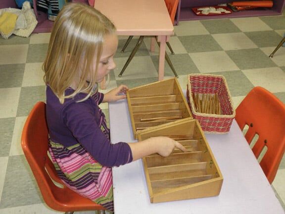 Little Girl Playing Toy Divider — Riverside, CA — Cottonwood Montessori