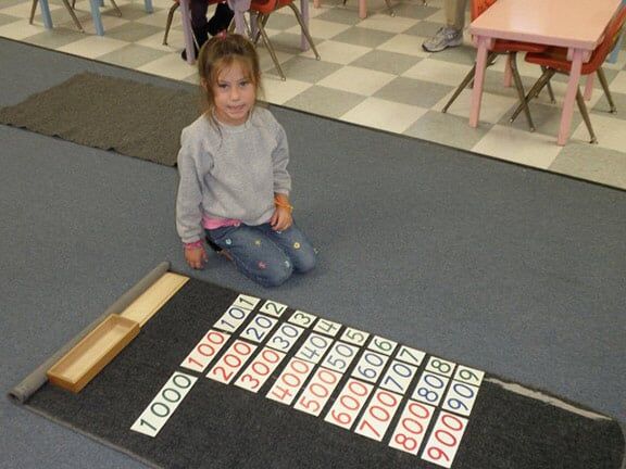 Little Girl Playing Numbers — Riverside, CA — Cottonwood Montessori
