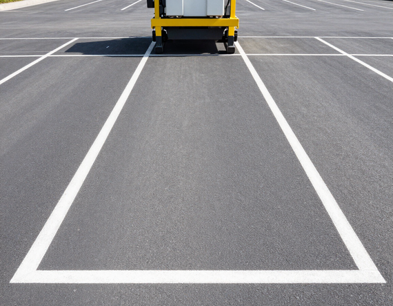 Freshly striped commercial parking lot with bright white lines