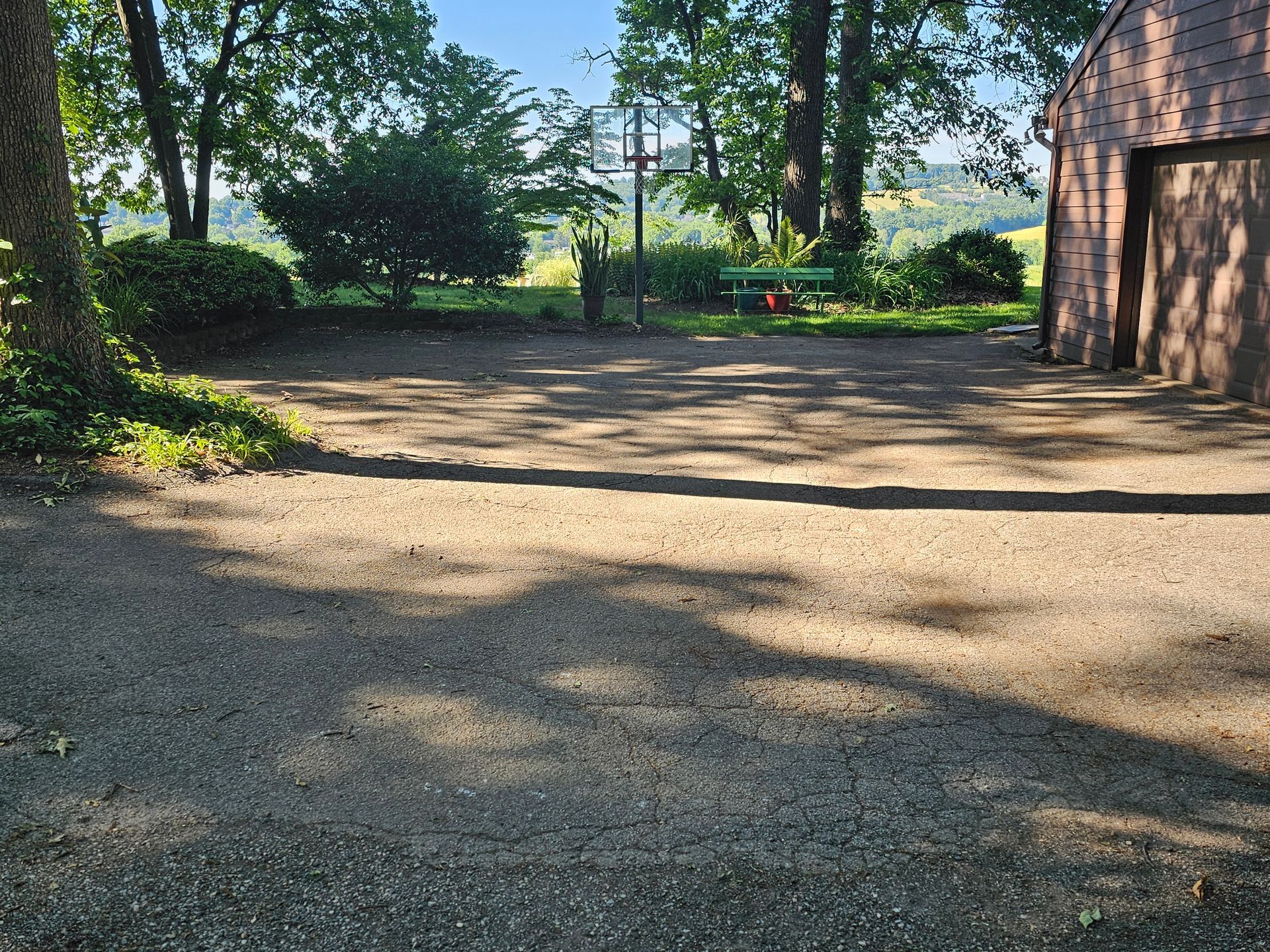 Before: Weathered, cracked asphalt &mdash; rural property, York County