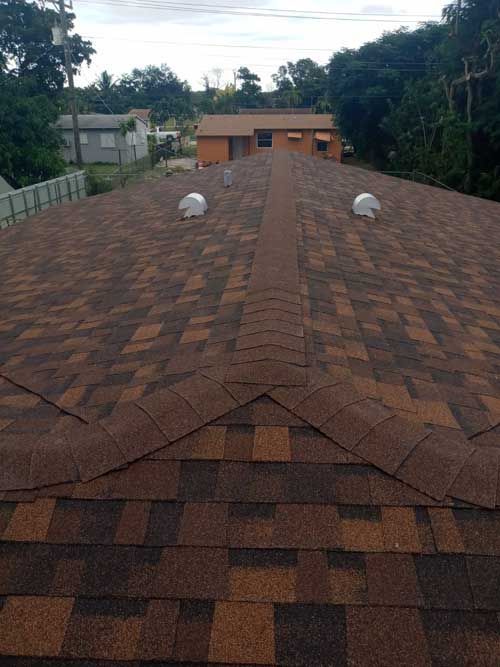 Wind Damaged House Roof
