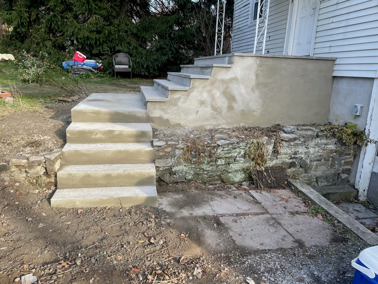 A set of concrete steps leading up to a house