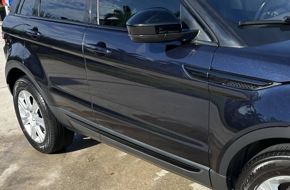 Dark blue Range Rover SUV parked outdoors.