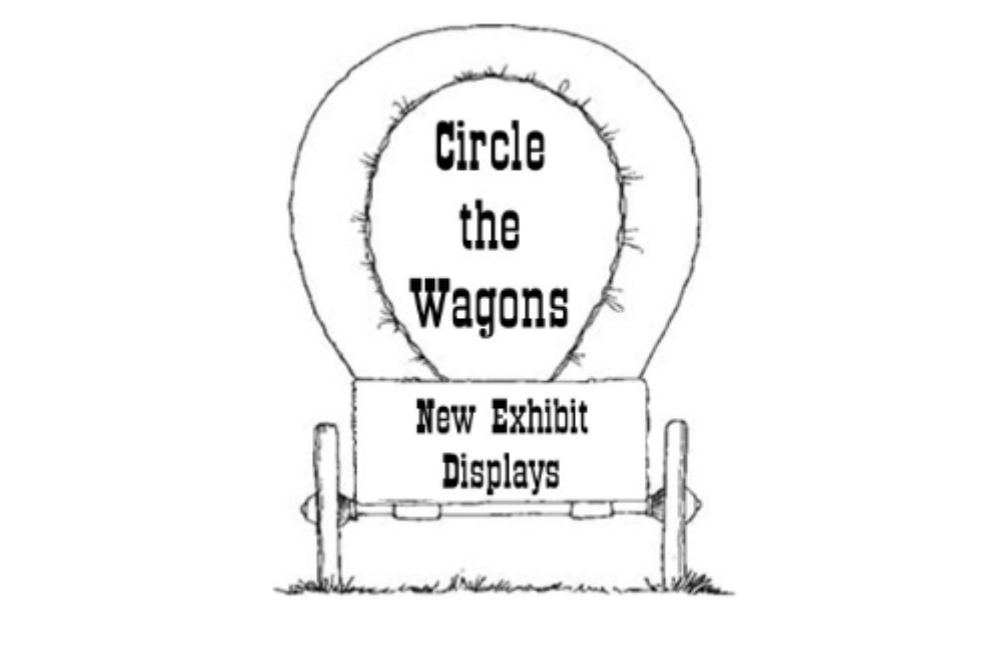 Line drawing of a covered wagon featuring text that reads