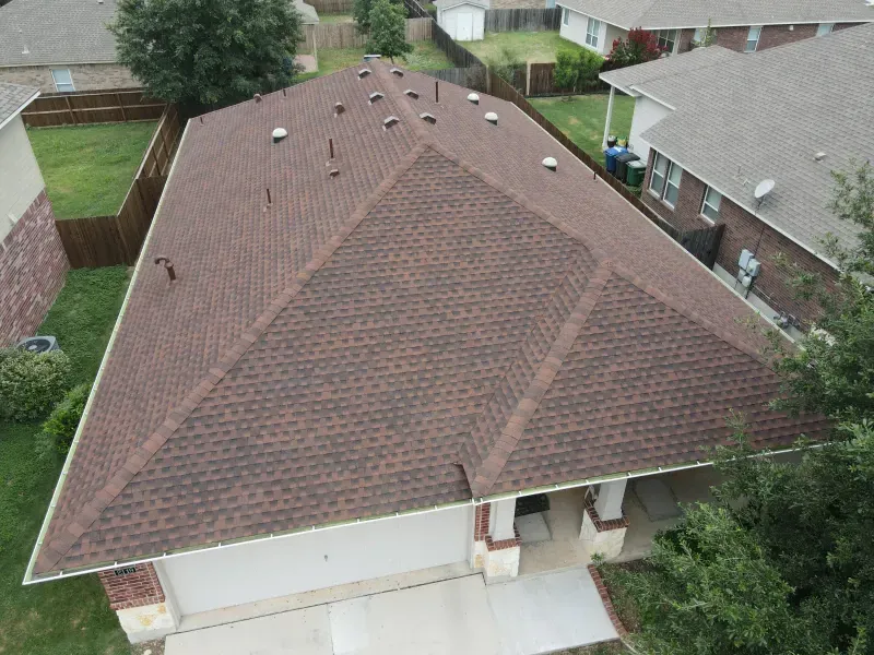 An aerial view of a house with a brown roof.