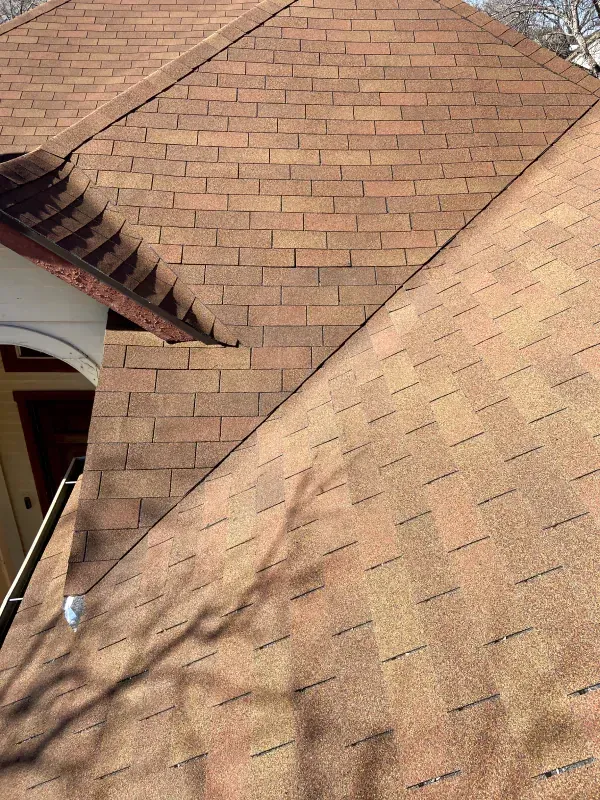 A close up of a roof with shingles on it.