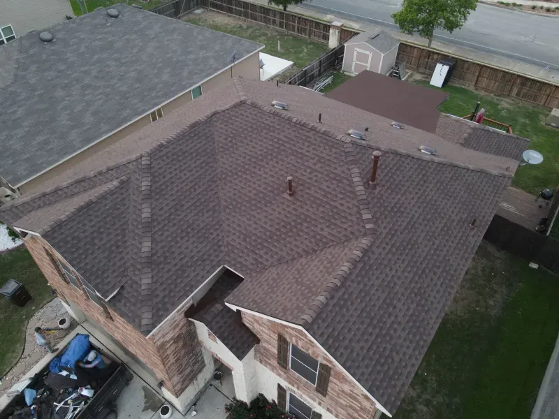 An aerial view of a house with a new roof.