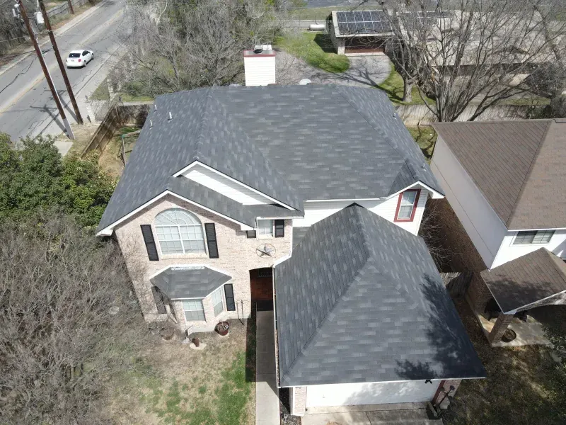 An aerial view of a house with a new roof