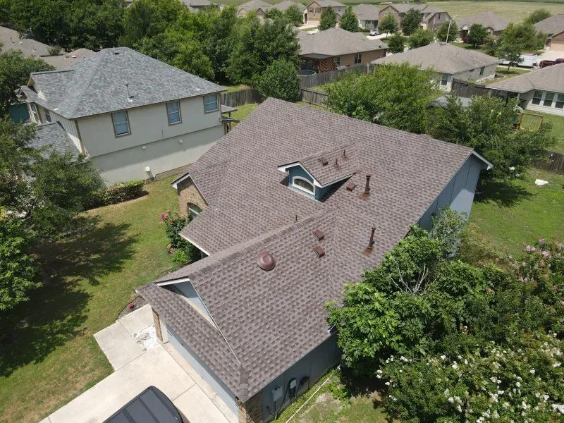 An aerial view of a house with a new roof