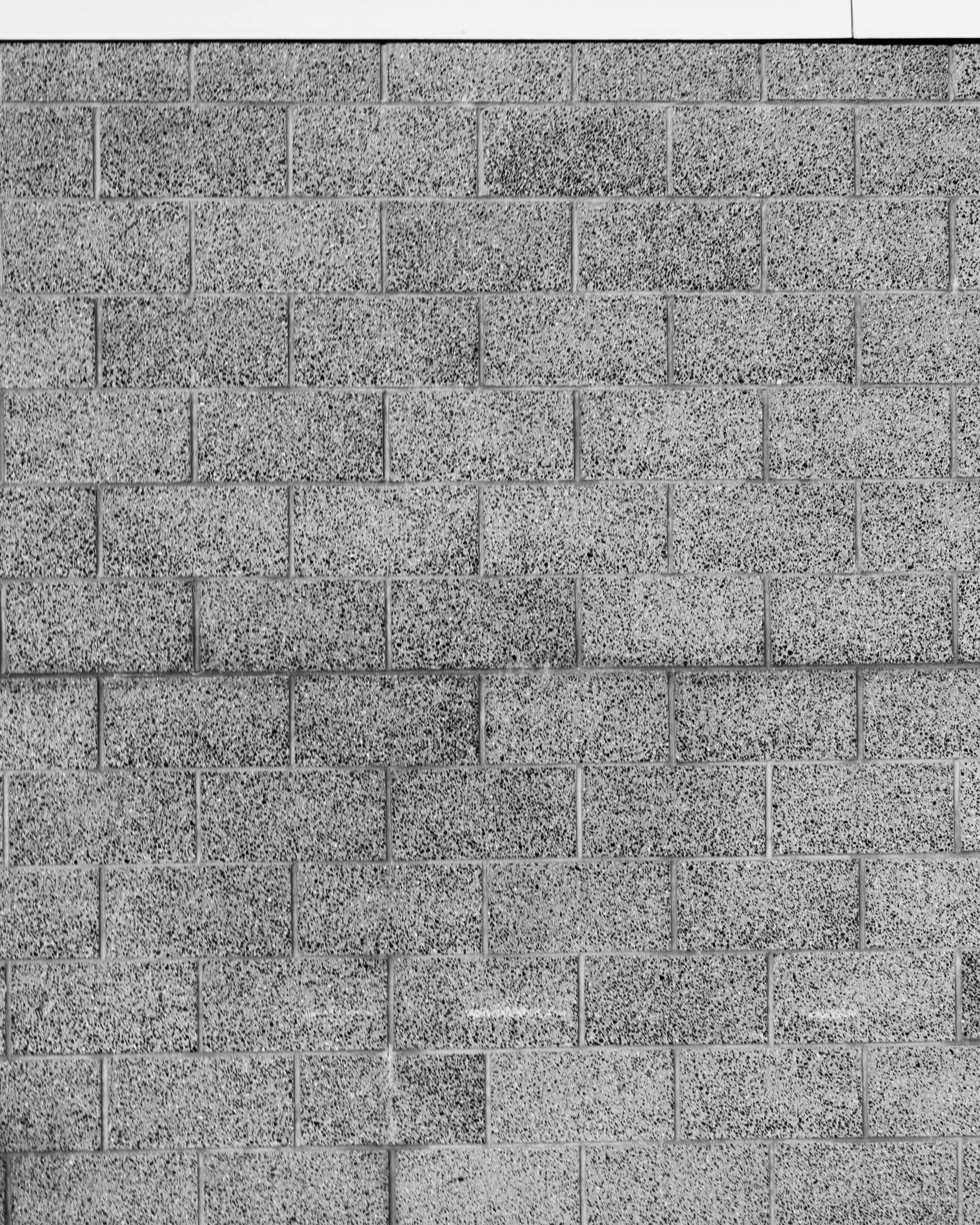 Close-up of gray concrete block wall with clean mortar joints in Coral Gables.