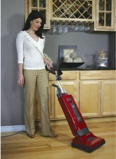 Vacuum Cleaners — Woman Cleaning the Floor Using Vacuum in Meridian, ID