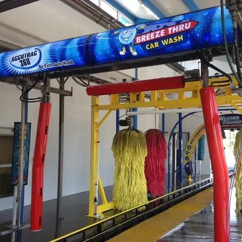 Yellow sudsy car, carwash consulting, design and installations