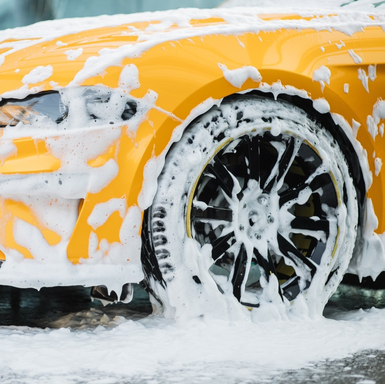 Yellow sudsy car, carwash consulting, design and installations