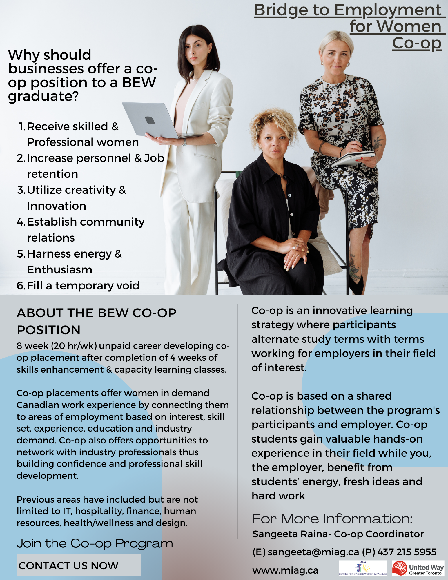 A group of women are standing around a table in an office.