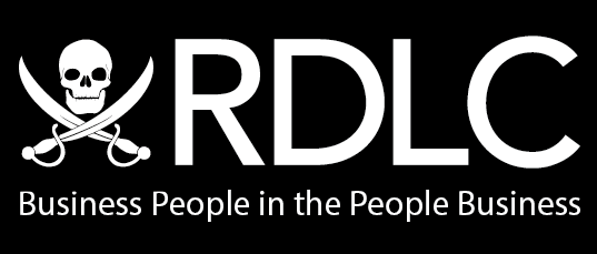 A white logo with a skull and crossbones and the words `` business people in the people business ''.