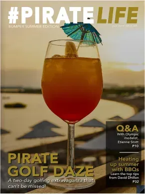 A wine glass with a drink in it on the cover of a magazine.