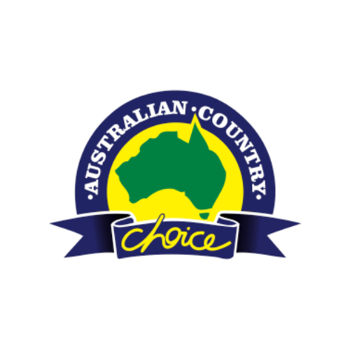 A man in a yellow vest is working on a stack of wood